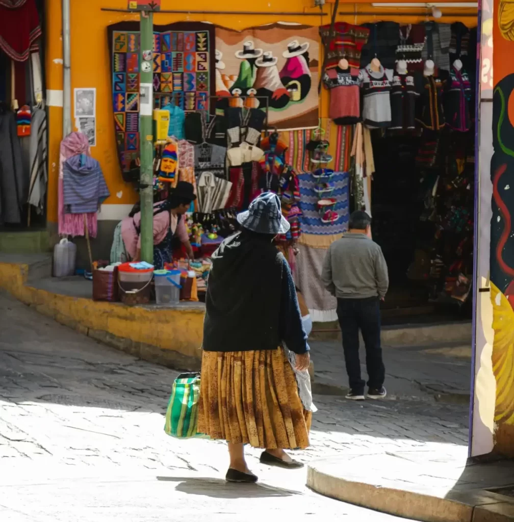 View of the Witches' Market in La Paz, Bolivia, featuring stalls with herbs, amulets, and traditional Andean spiritual items.