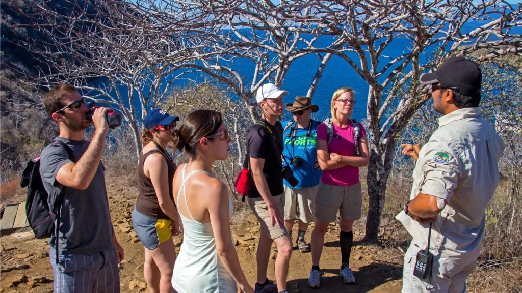 Local guide shares knowledge with attentive tourists-Galápagos trip