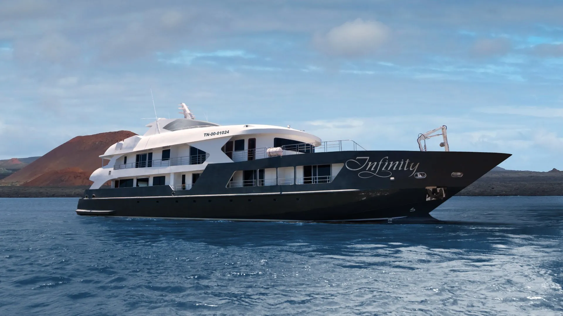 The Infinity cruise ship sails elegantly over the crystal clear waters of the Galapagos Islands-luxury Galapagos cruise