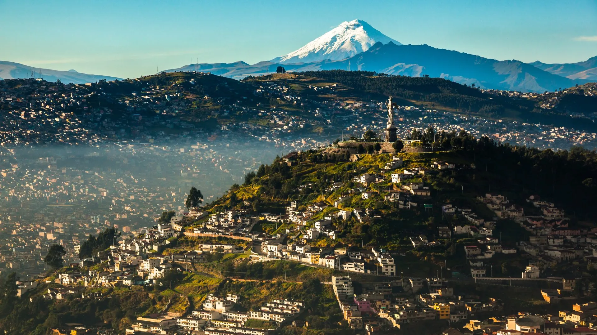 Quito reveals its majesty with El Panecillo and the imposing Cotopaxi volcano-Quito or Cuenca
