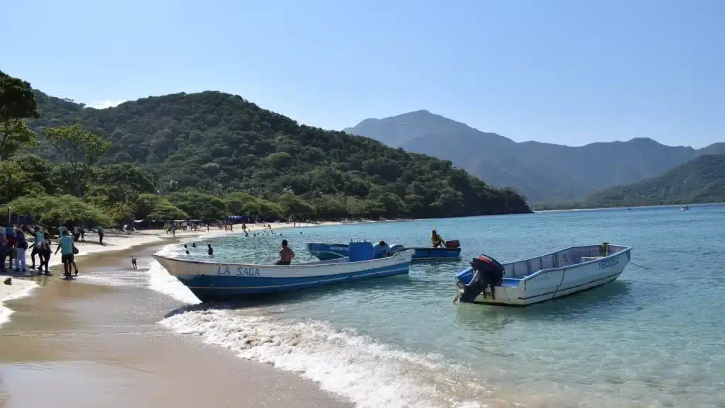 Playa Cristal with boats on turquoise waters-Santa Marta culture and nature