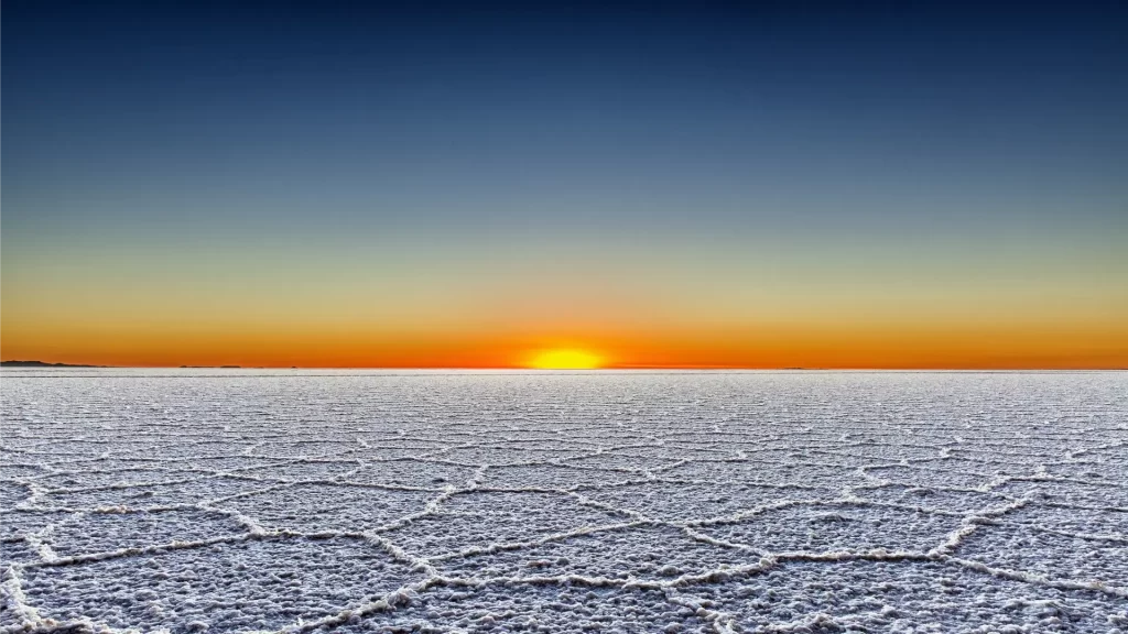 Sunset over Salar de Uyuni in Bolivia, one of the most unique romantic places in Latin America.
